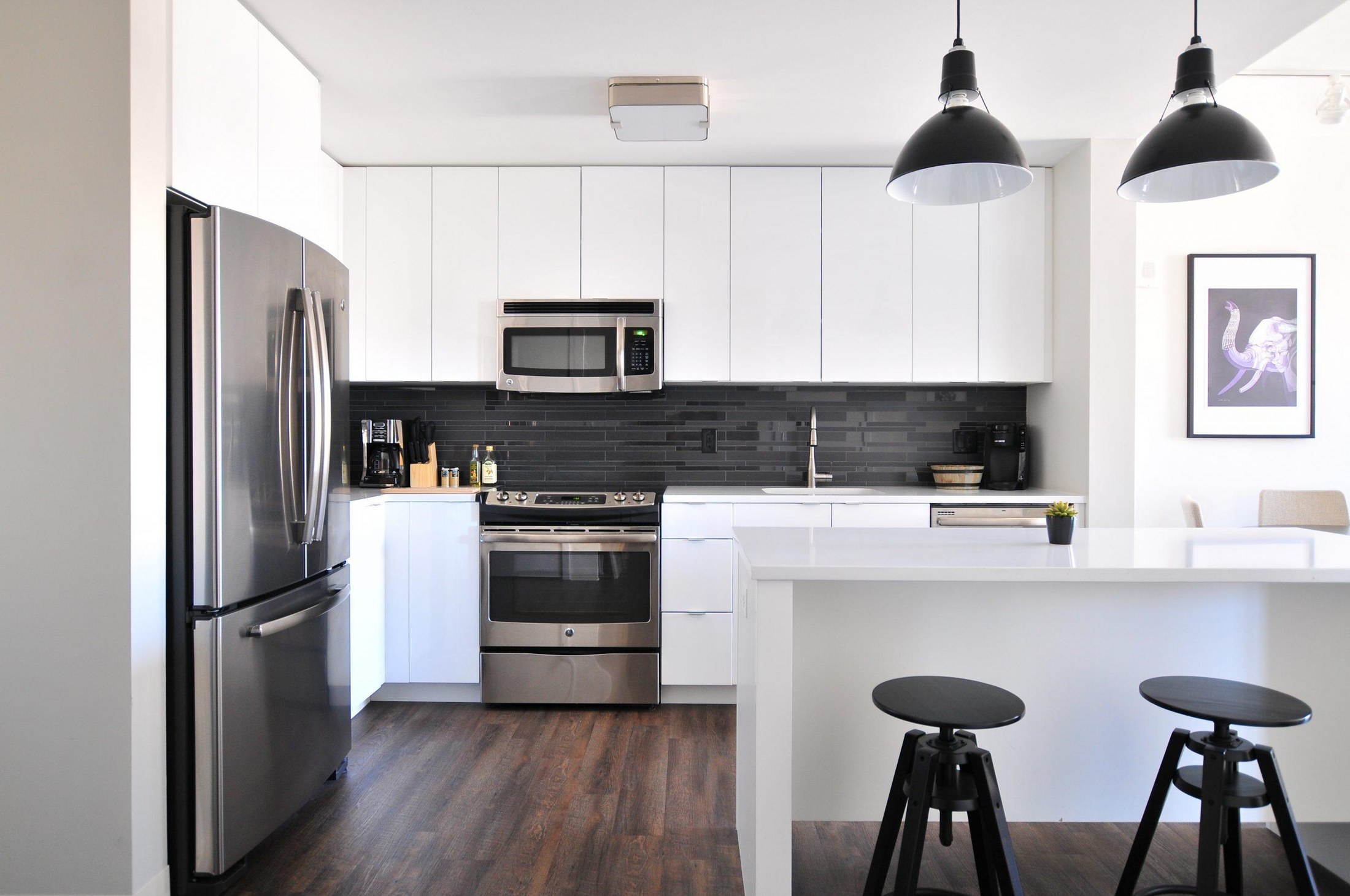 Compact white cabinet kitchen for an ADU